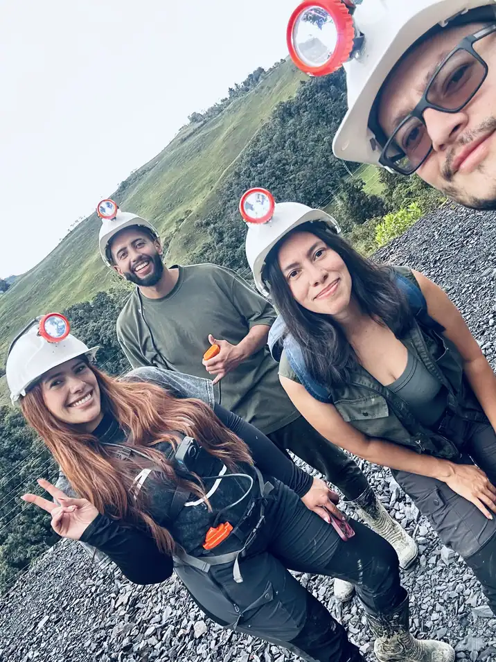 Andean Scapes local hosts in mining helmets in Chivor, Boyacá